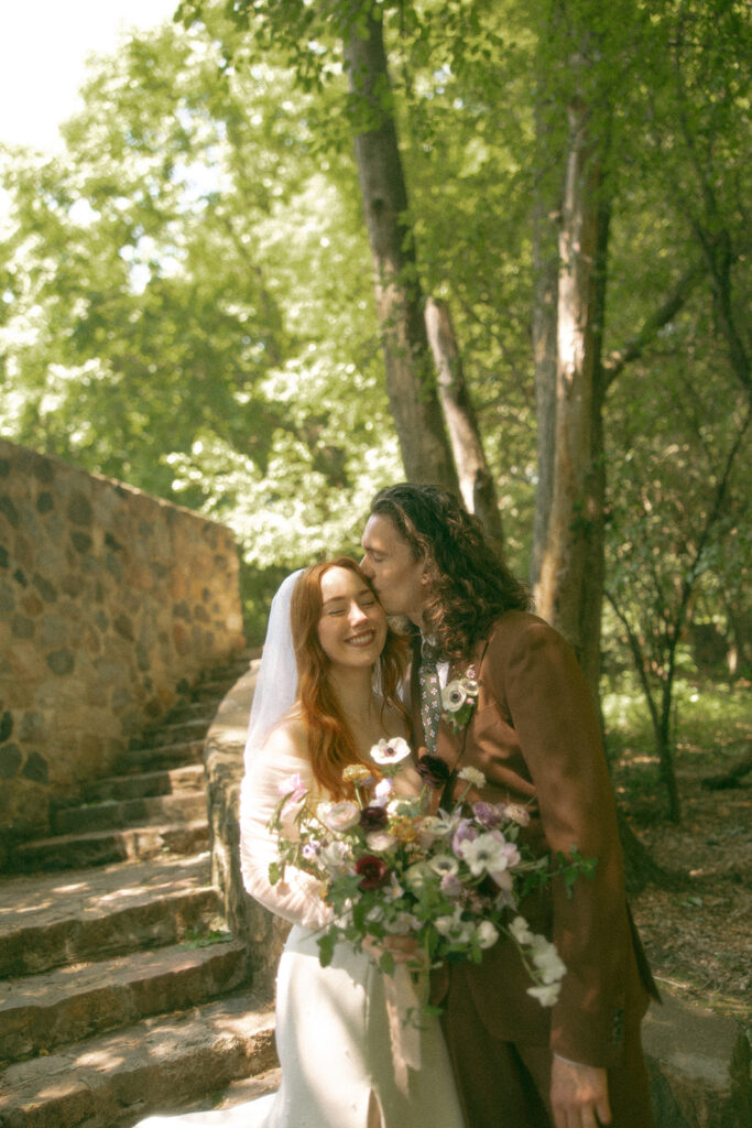 Whimsical outdoor bride and grooms portraits from their Stony Creek Metropark wedding in Detroit, Michigan