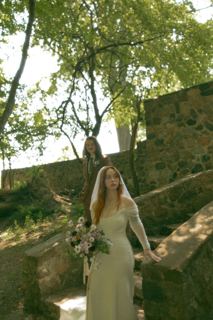 Whimsical outdoor bride and grooms portraits from their Stony Creek Metropark wedding in Detroit, Michigan