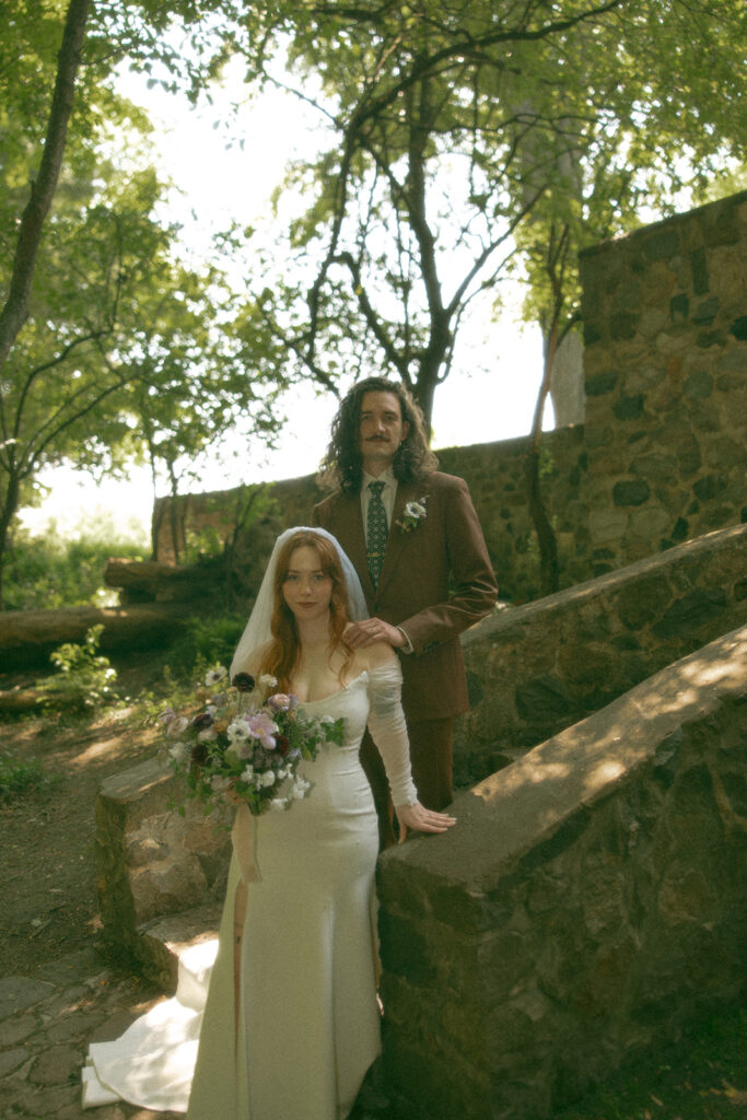 Whimsical outdoor bride and grooms portraits from their Stony Creek Metropark wedding in Detroit, Michigan