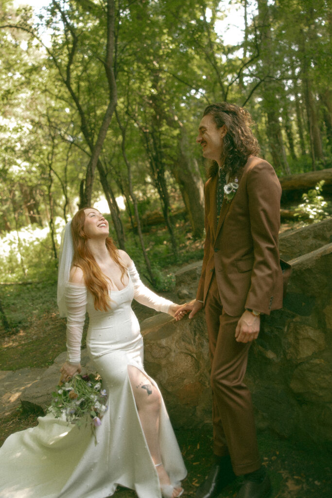 Whimsical outdoor bride and grooms portraits from their Stony Creek Metropark wedding in Detroit, Michigan