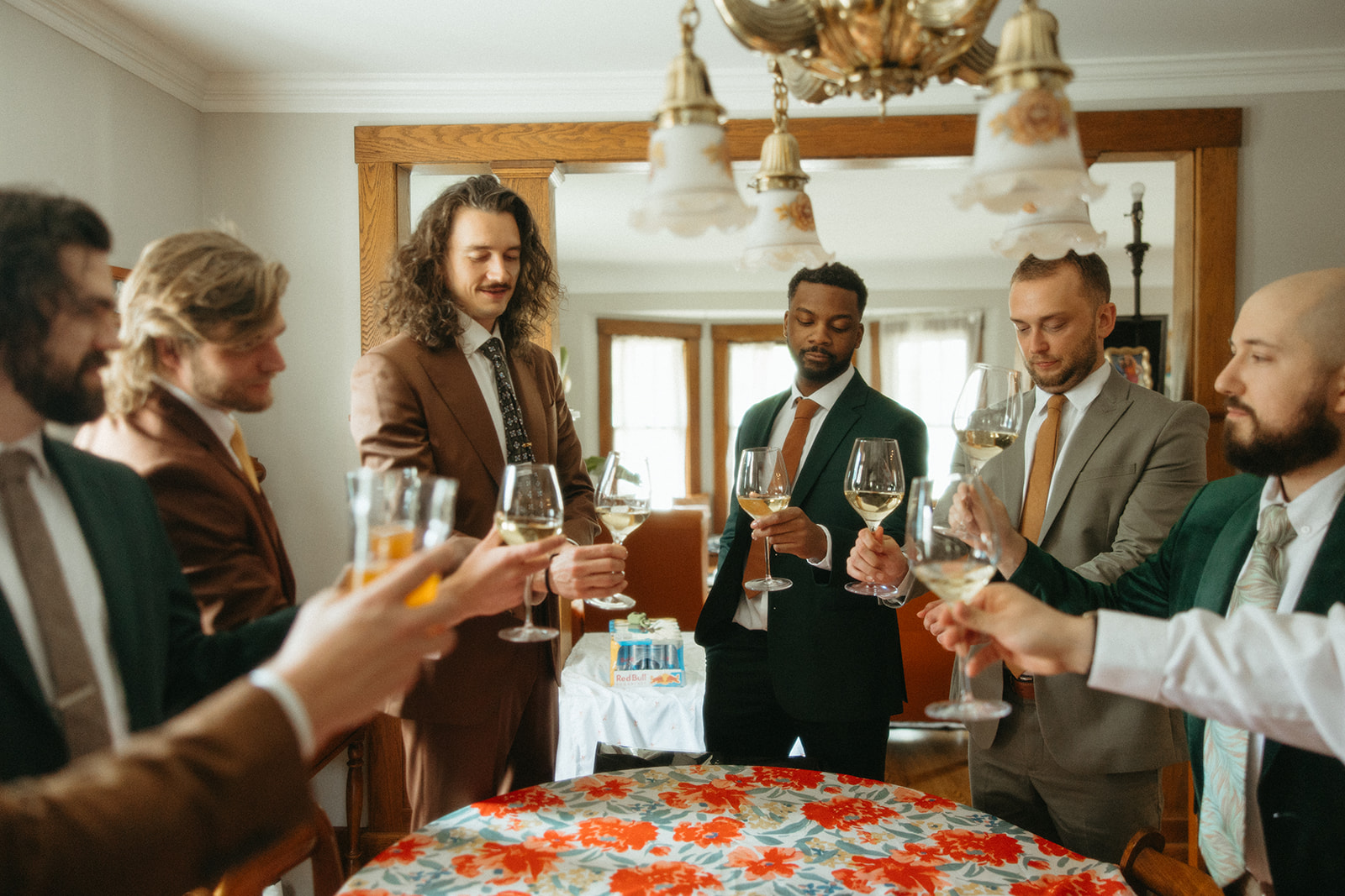 Groom and his groomsmen toasting with wine before his Detroit, Michigan wedding