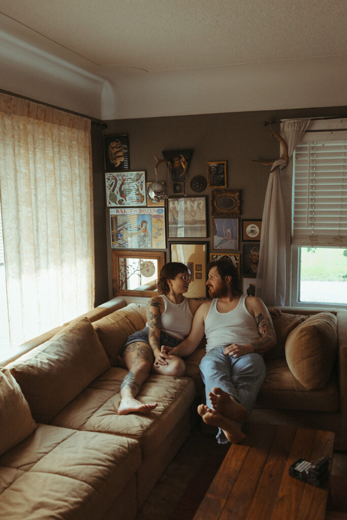 Man and woman holding hands during their at-home Grand Rapids engagement photos