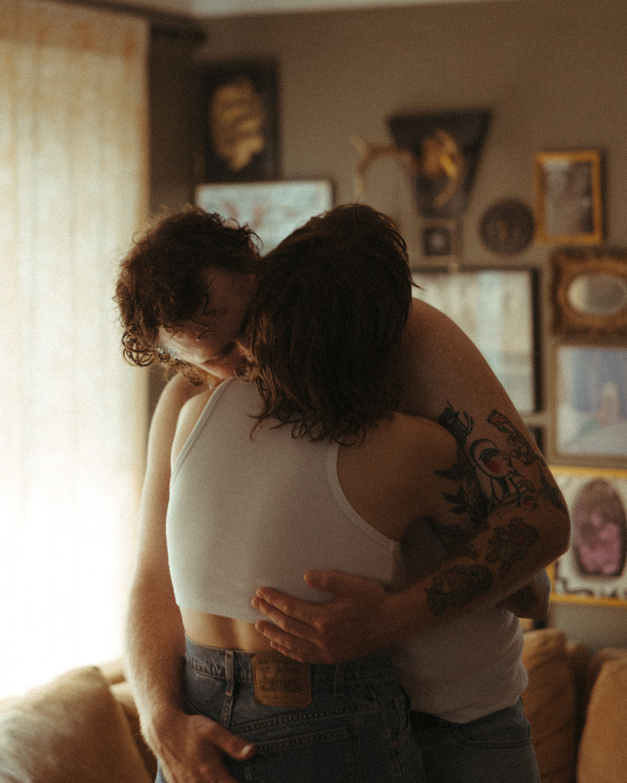 Man and woman hugging in their living room