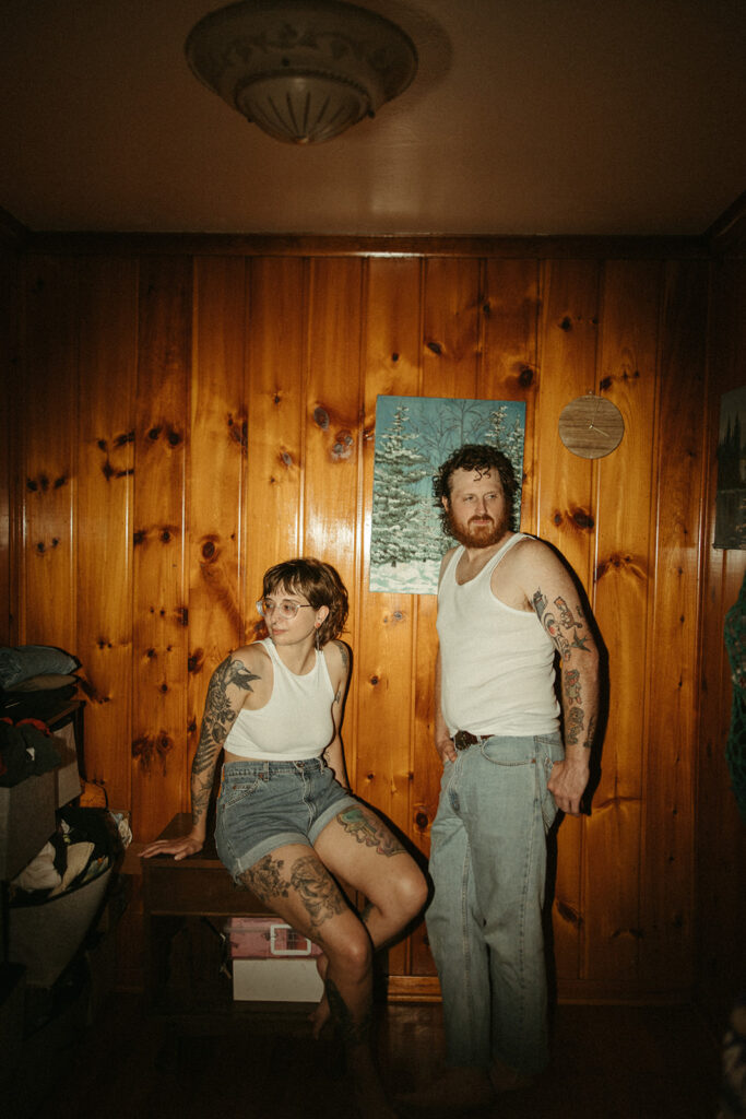 Flash photo of a couple posing for their at-home Grand Rapids engagement photos