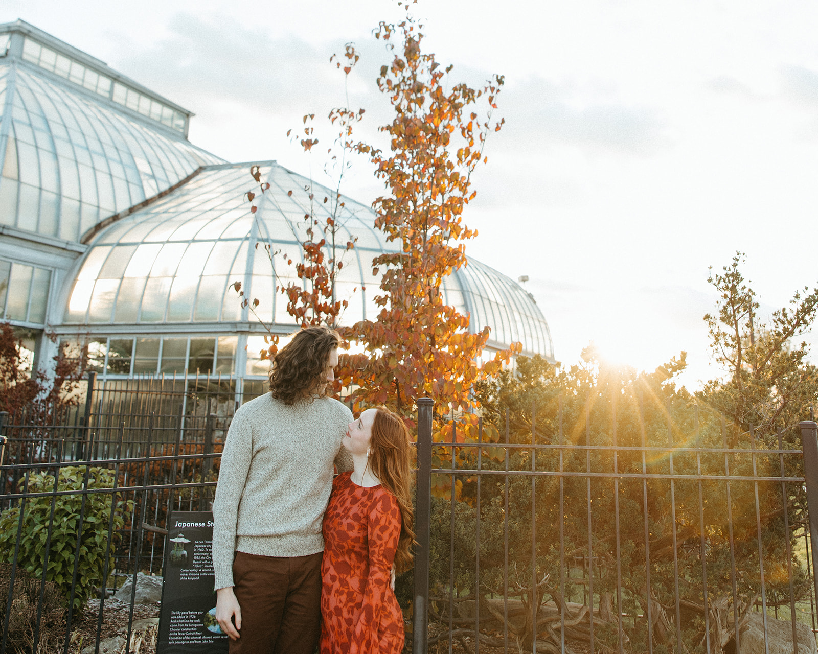 Couple posing for their Belle Isle engagement photos in Detroit, Michigan