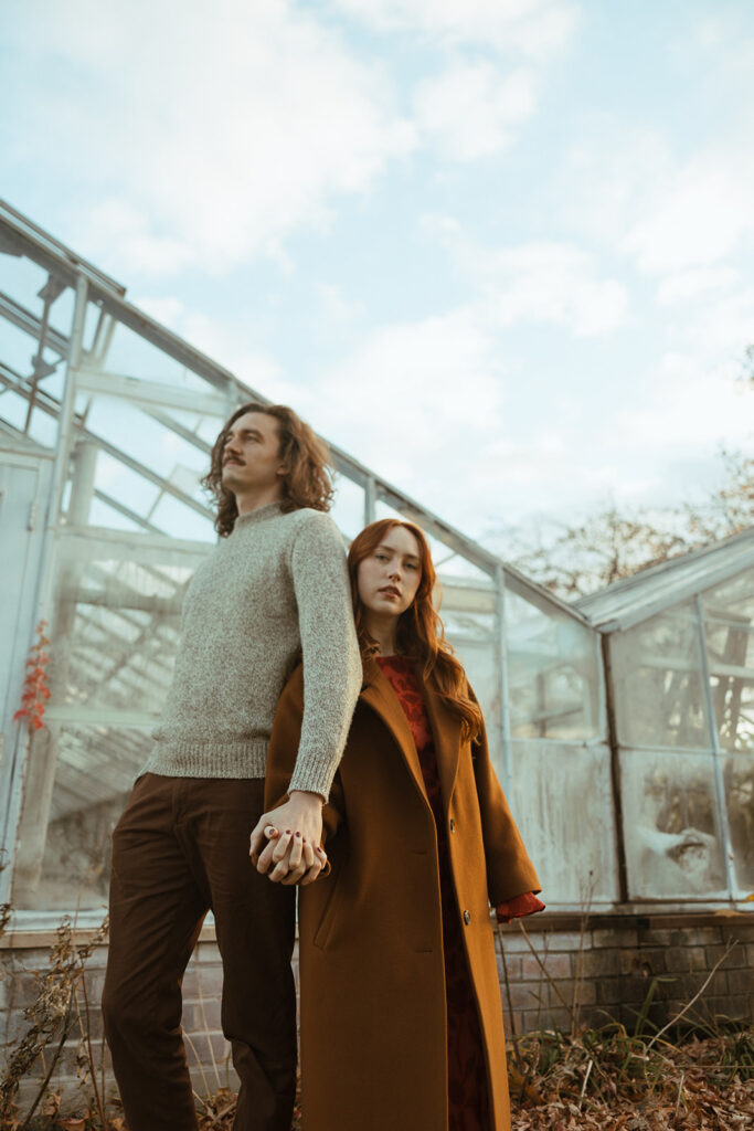 Man and woman posing for their Belle Isle engagement photos in Detroit, Michigan