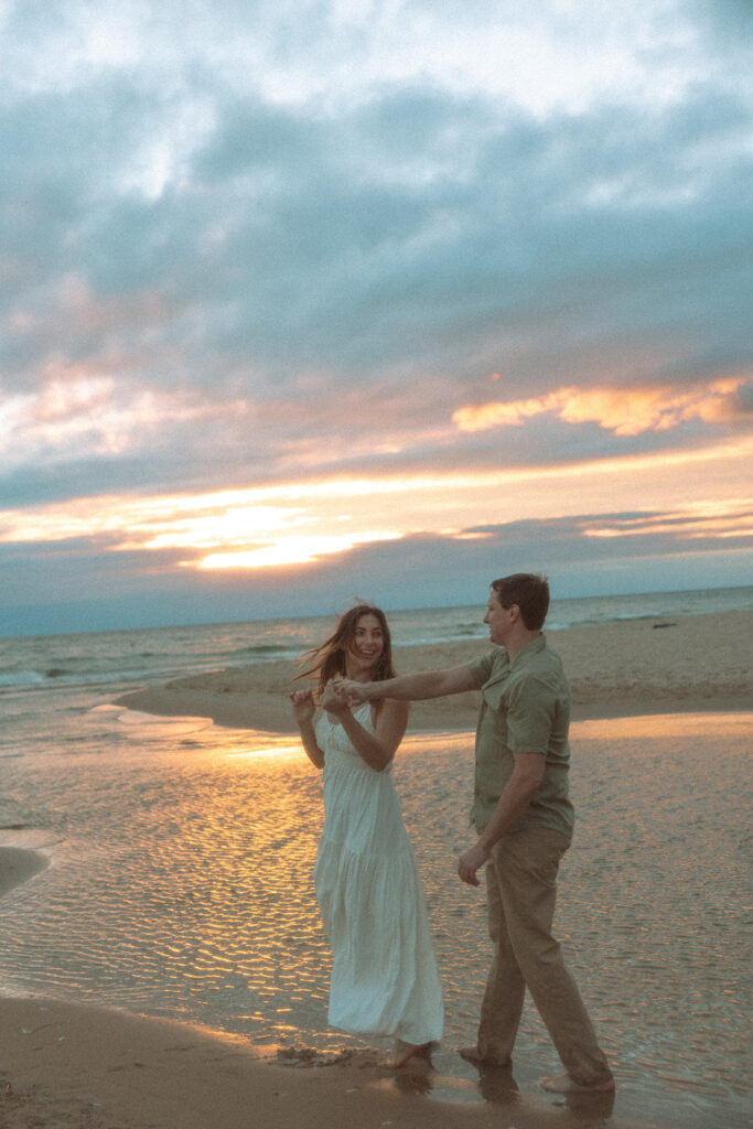 Couples sunset Lake Michigan engagement photos at Duck Lake State Park in Muskegon