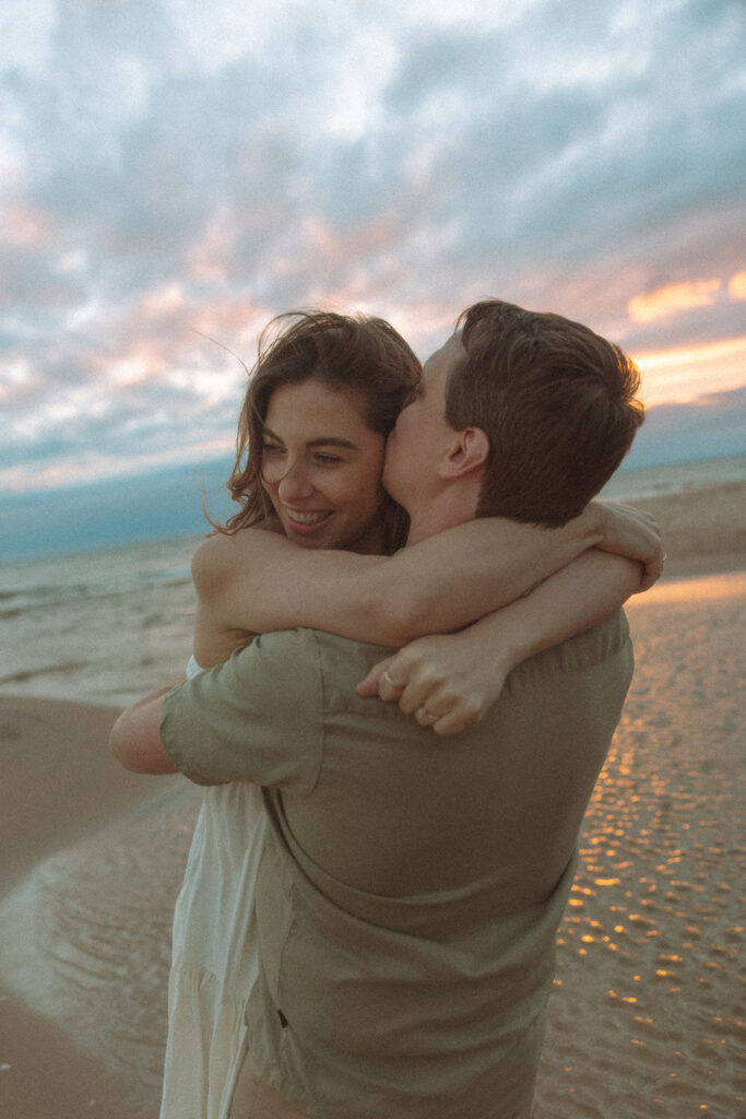 Couples sunset Lake Michigan engagement photos at Duck Lake State Park in Muskegon