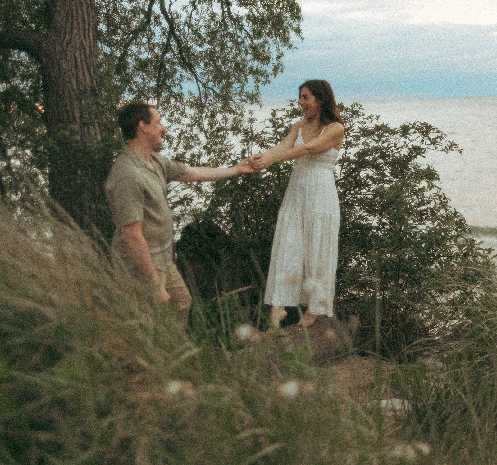 Couples Lake Michigan engagement photos at Duck Lake State Park in Muskegon