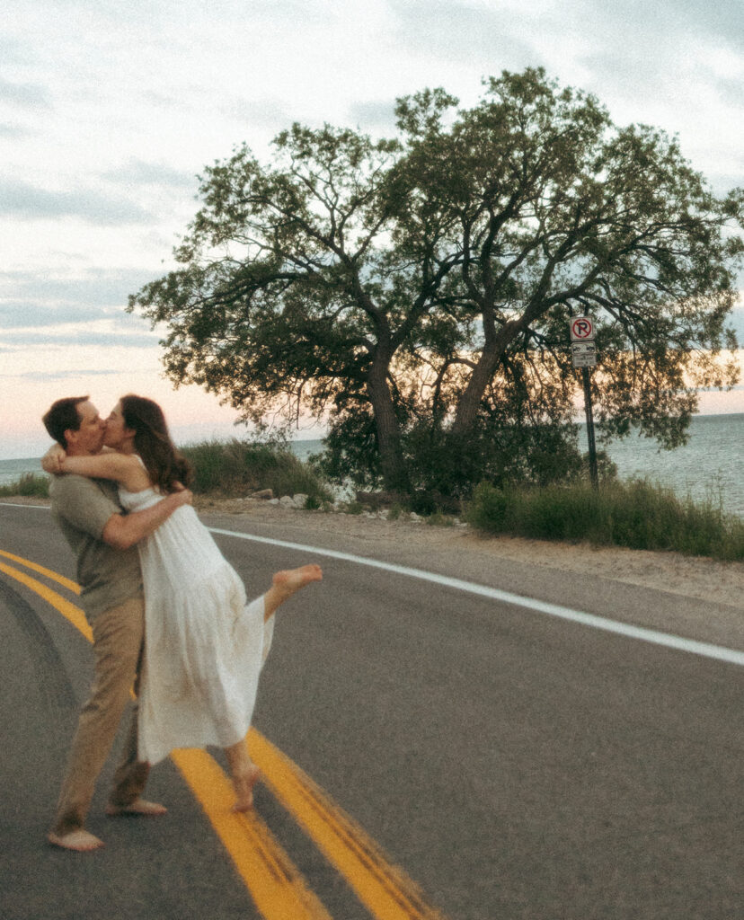 Couple standing in the road during their engagement shoot