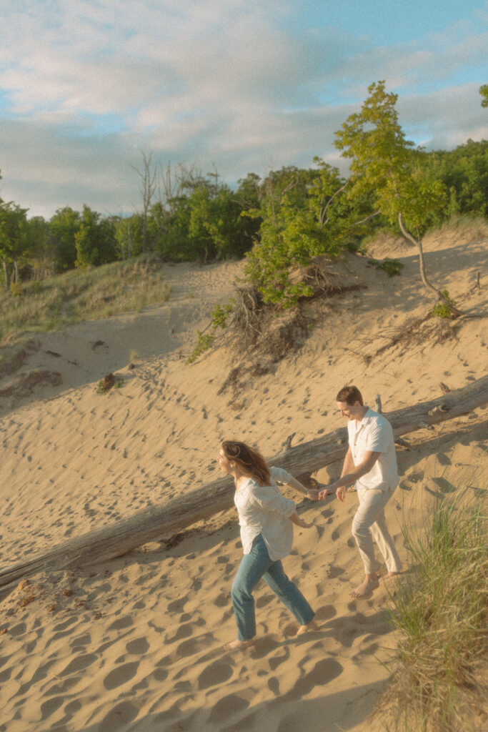 Man and woman walking down the beach