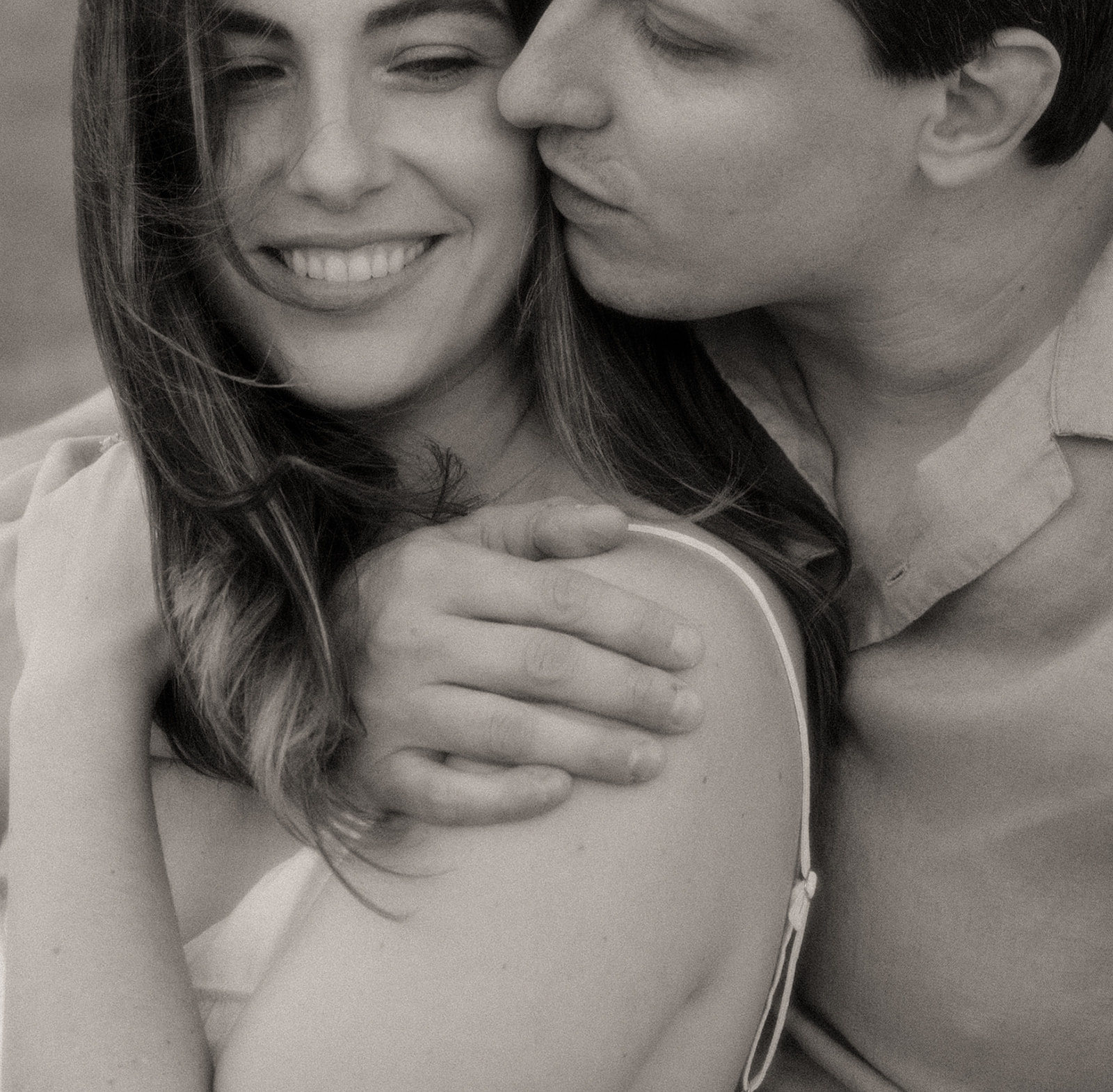 Black and white close up shot of a couple during their Lake Michigan engagement session