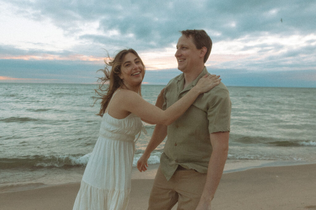 Couples Michigan beach engagement photos at Duck Lake State Park in Muskegon