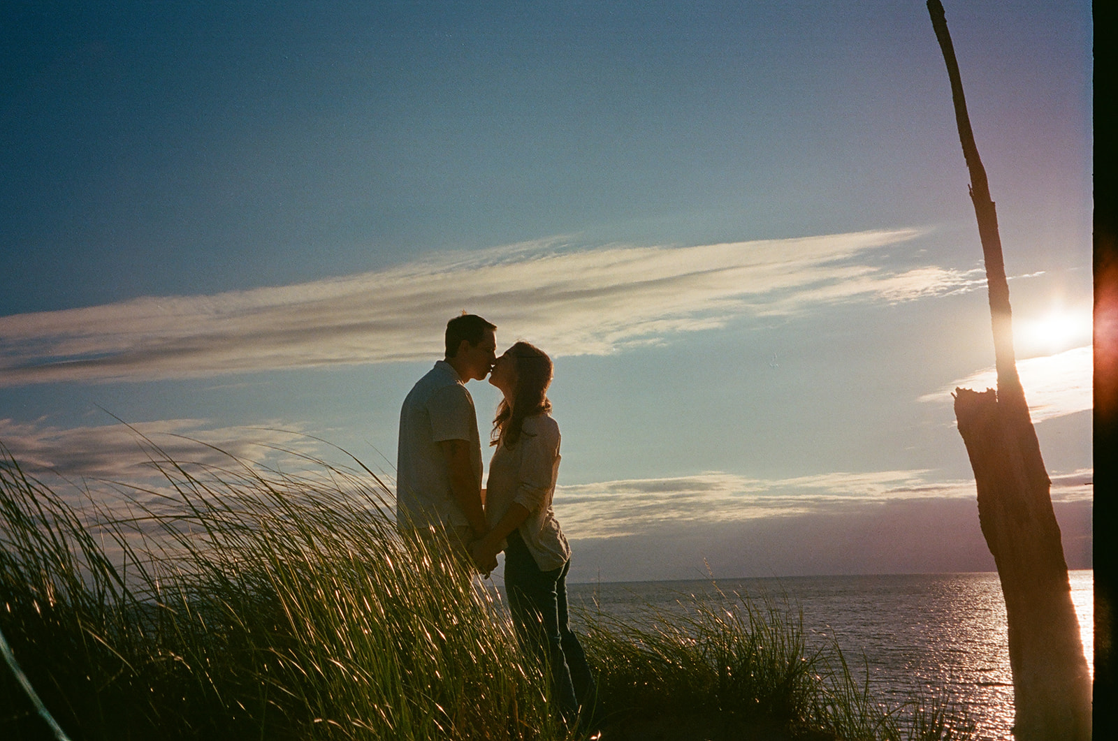 Couples Michigan engagement session at sunset captured on film