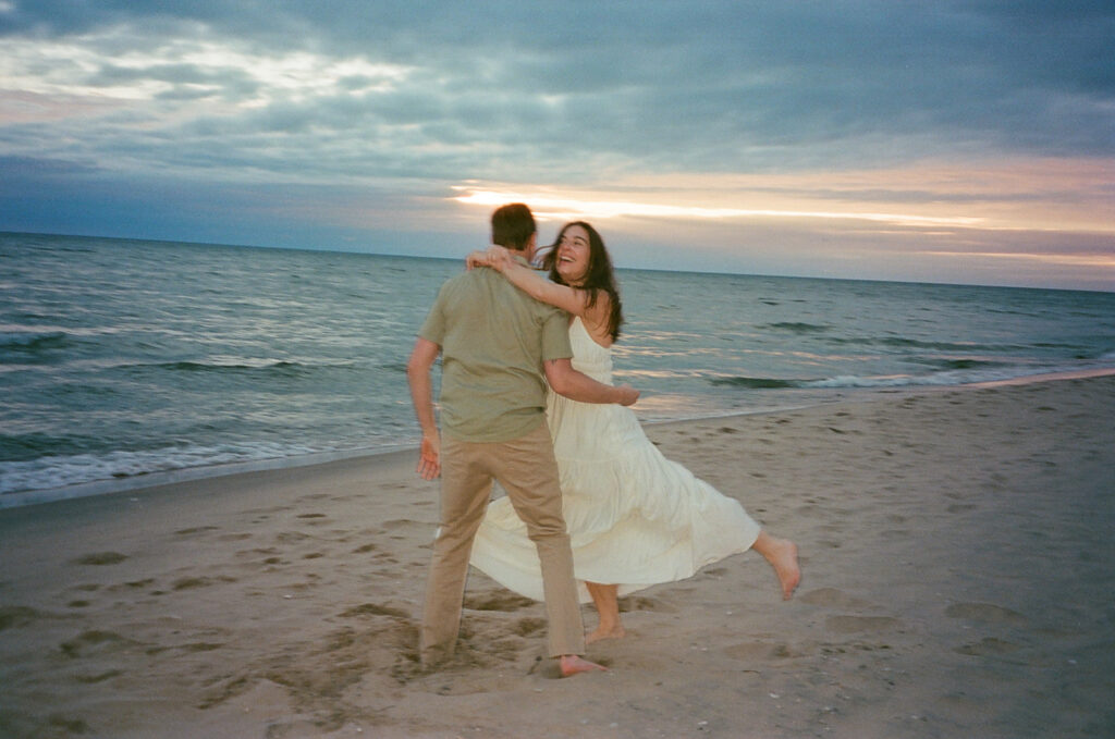 Couple being playful on the beach