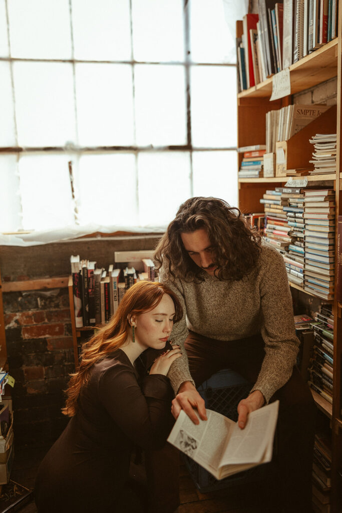 Couple reading a book together at John K King Books in Detroit, Michigan