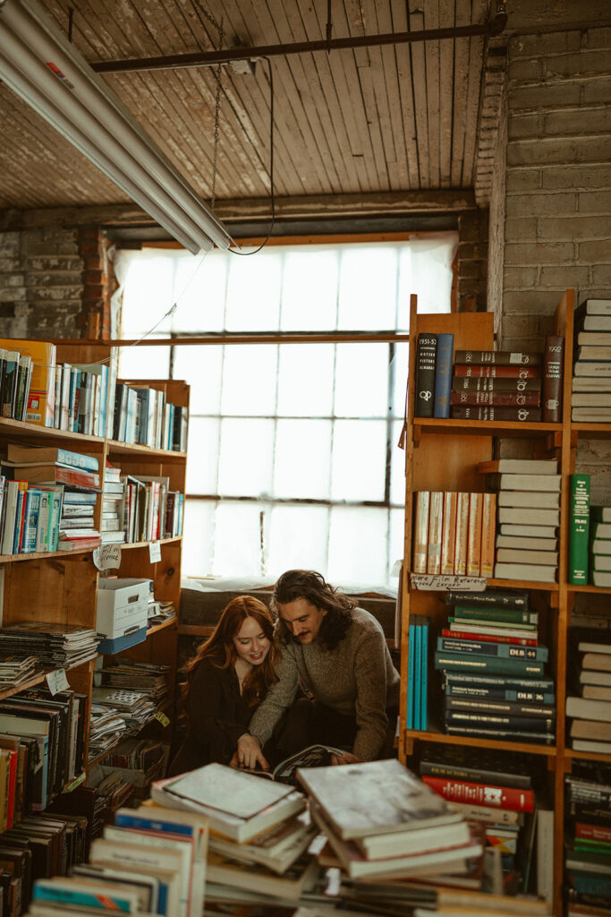 Couple reading a book together at John K King Books in Detroit, Michigan