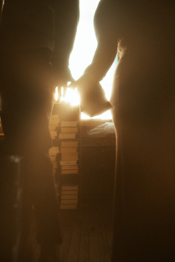 Couple holding hands at a books store