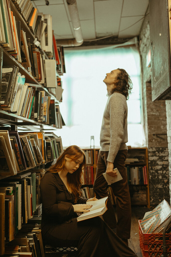 Man and woman reading books at John K King Books in Detroit, Michigan