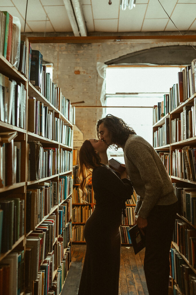 Couple kissing at John K King Books in Detroit, Michigan