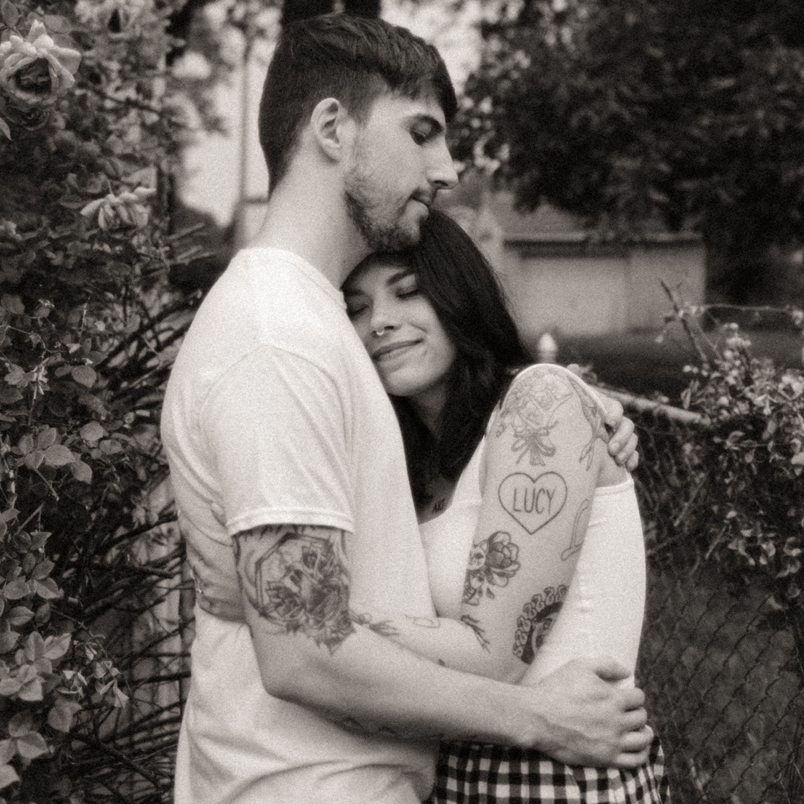 Black and white photo of a couple hugging