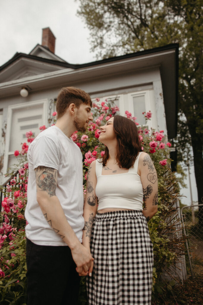 Couple smiling at each other during their Bay City engagement photos