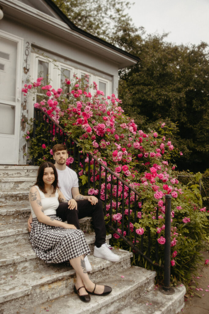 Couple sitting on the porch during their casual Bay City engagement photos in Michigan