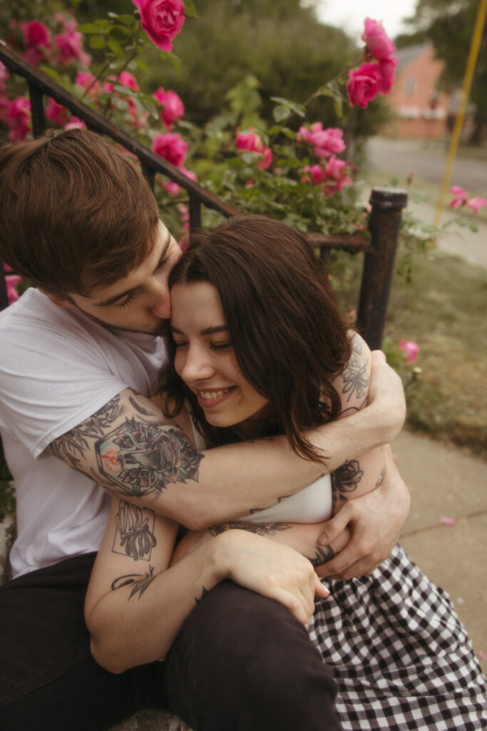 Man kissing his fiancé during their engagement session