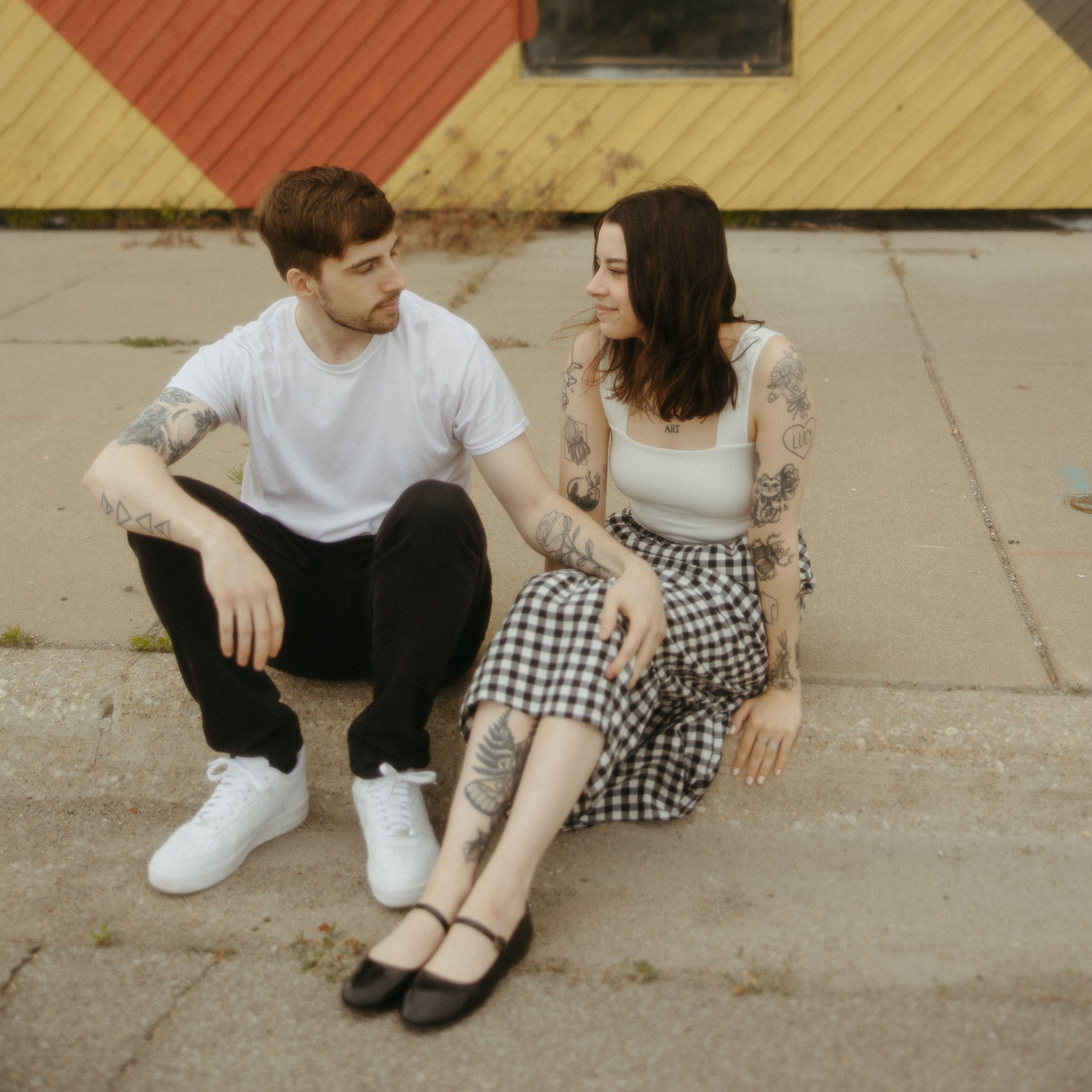 Couple sitting on a street together