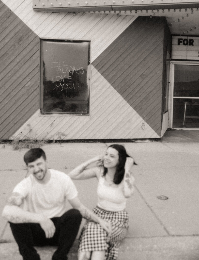 Black and white photo of a couple during their Bay City engagement photos downtown