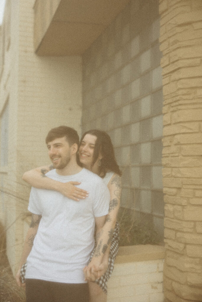 Couple laughing during their downtown engagement session