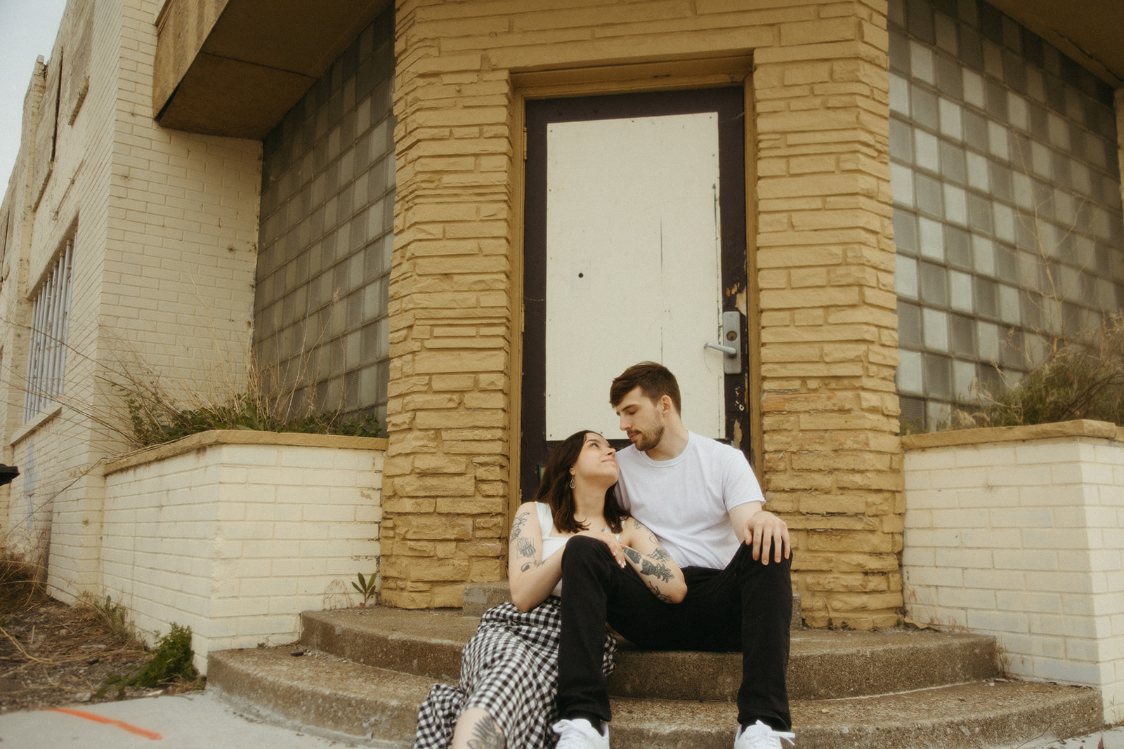 Couple looking at each other during their Bay City engagement photos