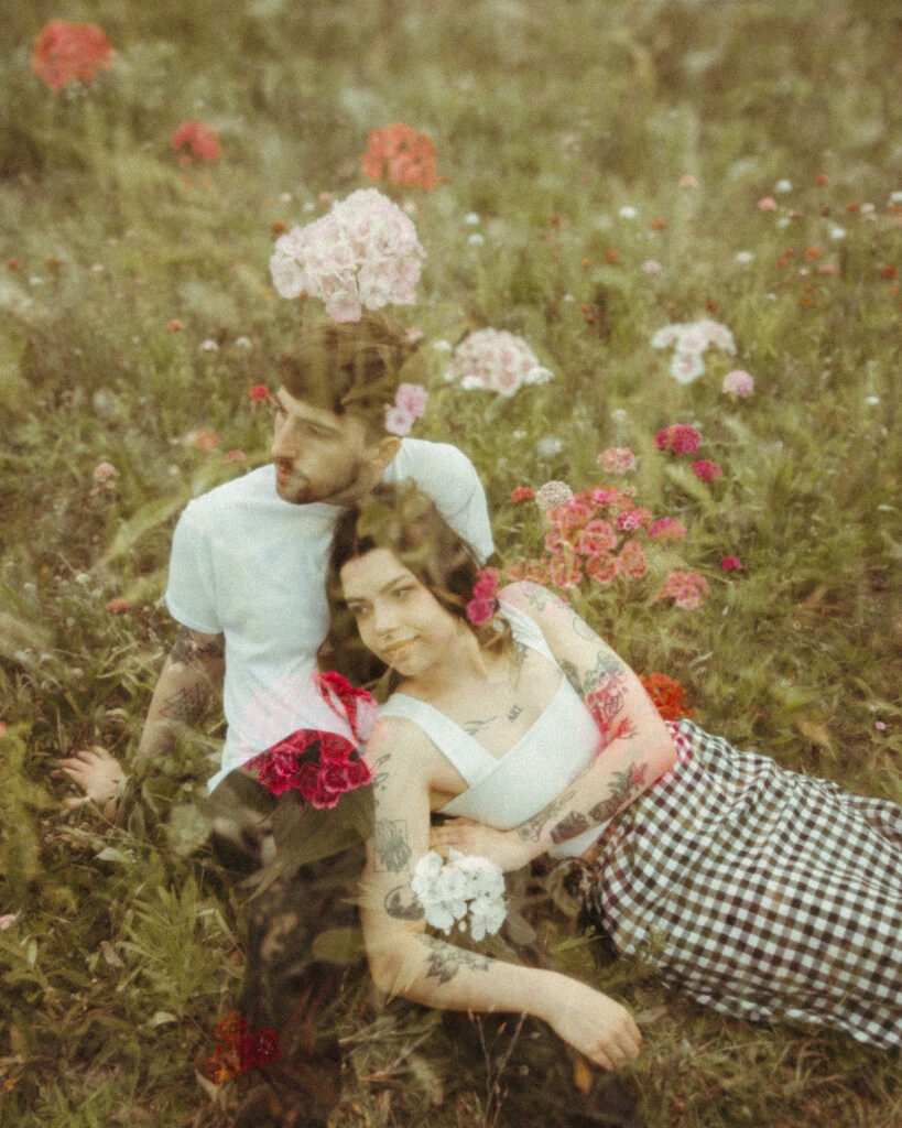 Double exposure engagement photos of a couples summer engagement photos in a patch of wild flowers