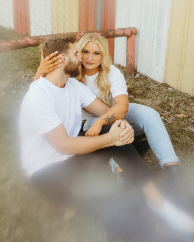 Couple posing for their outdoor engagement photos in Detroit, Michigan