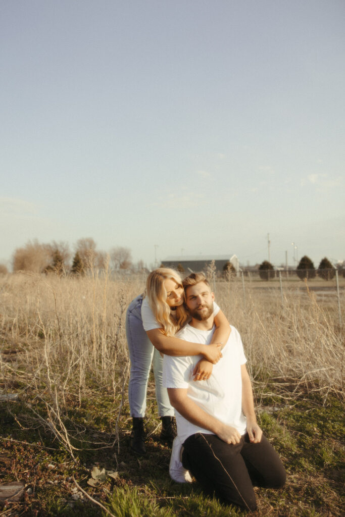 Couples Midwest field engagement photos at sunset