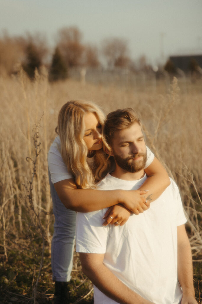 Midwest engagement photos in a field at sunset