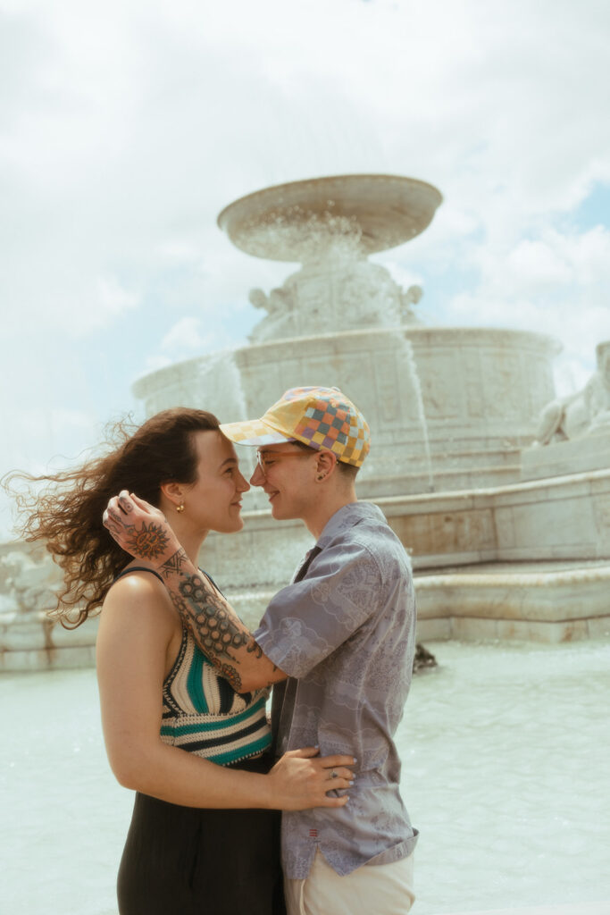 Couple posing for their Detroit engagement photos in Belle Isle