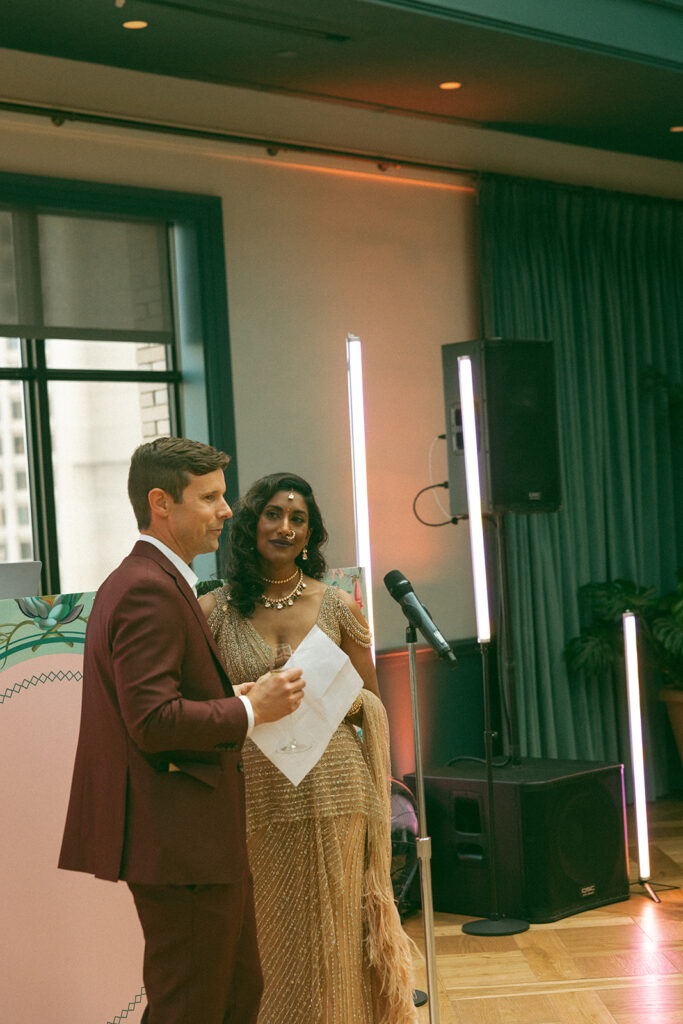 Couple giving a speech during their 20 year anniversary dinner