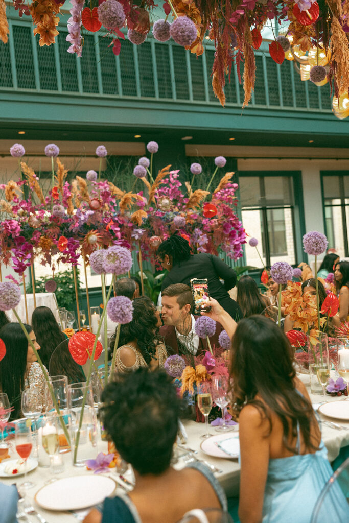 Couple sitting at their Book Tower wedding anniversary dinner table