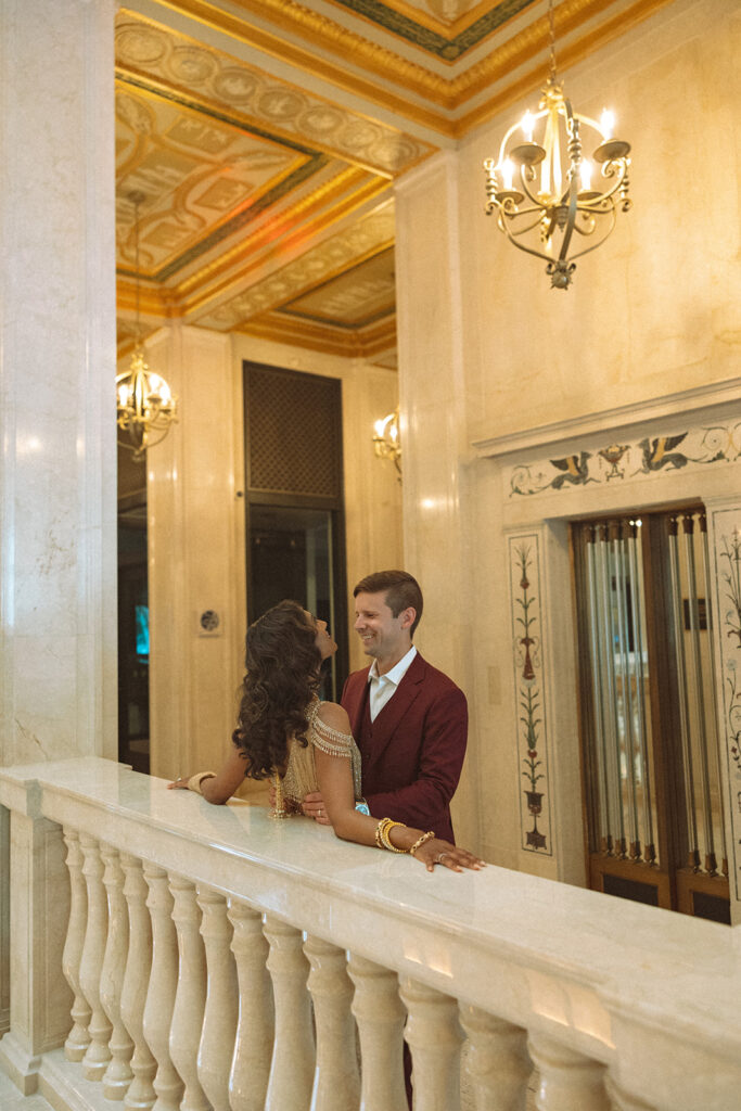 Couple posing for their Book Tower wedding anniversary portraits in Detroit, Michigan 