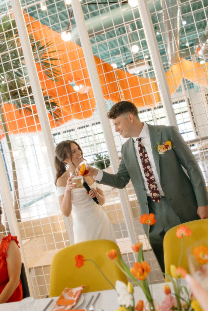 Bride and groom giving speeches during their Ann Arbor wedding reception at Venue by 4M