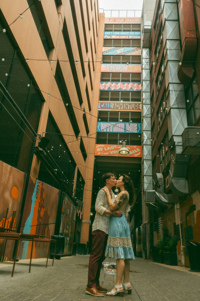 Couple kissing in The Belt Alley in downtown Detroit