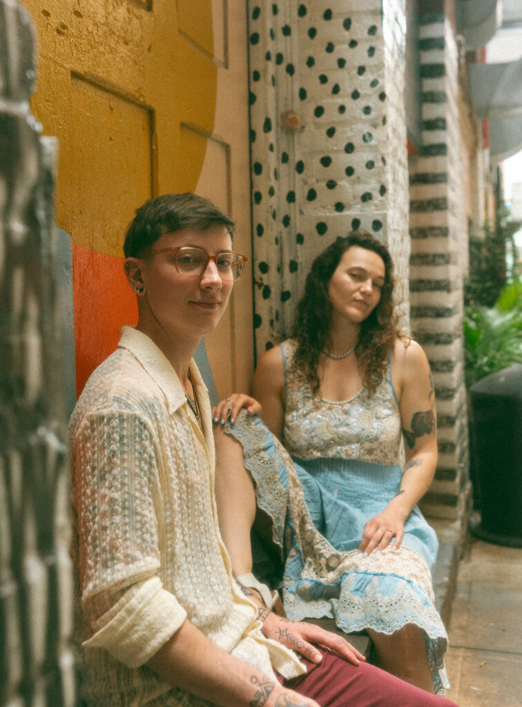 Couple posing for their Detroit engagement session in The Belt Alley in downtown Detroit