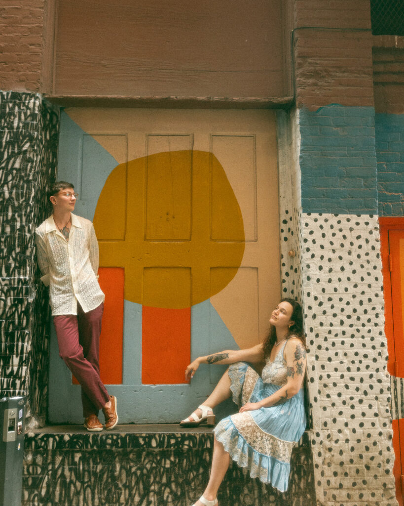 Couple posing for their Detroit engagement session in The Belt in downtown Detroit, Michigan