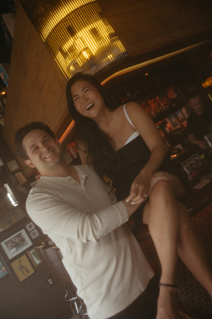 Couple laughing during their engagement shoot