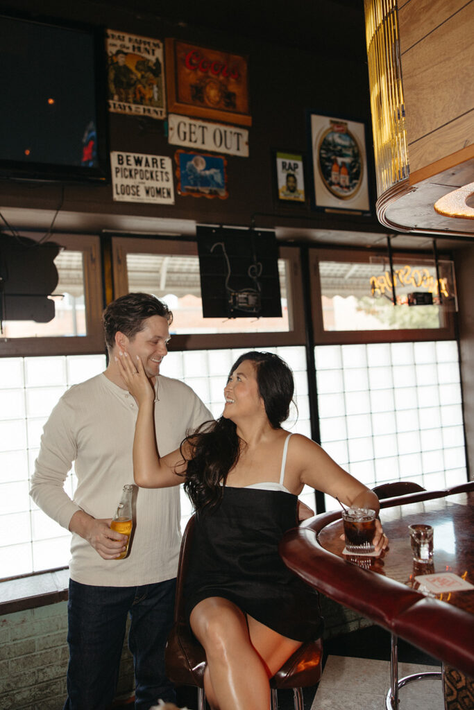 Couples Chicago engagement photos at a bar