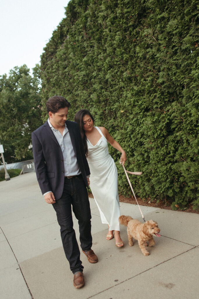 Couple walking with their dog in downtown Chicago