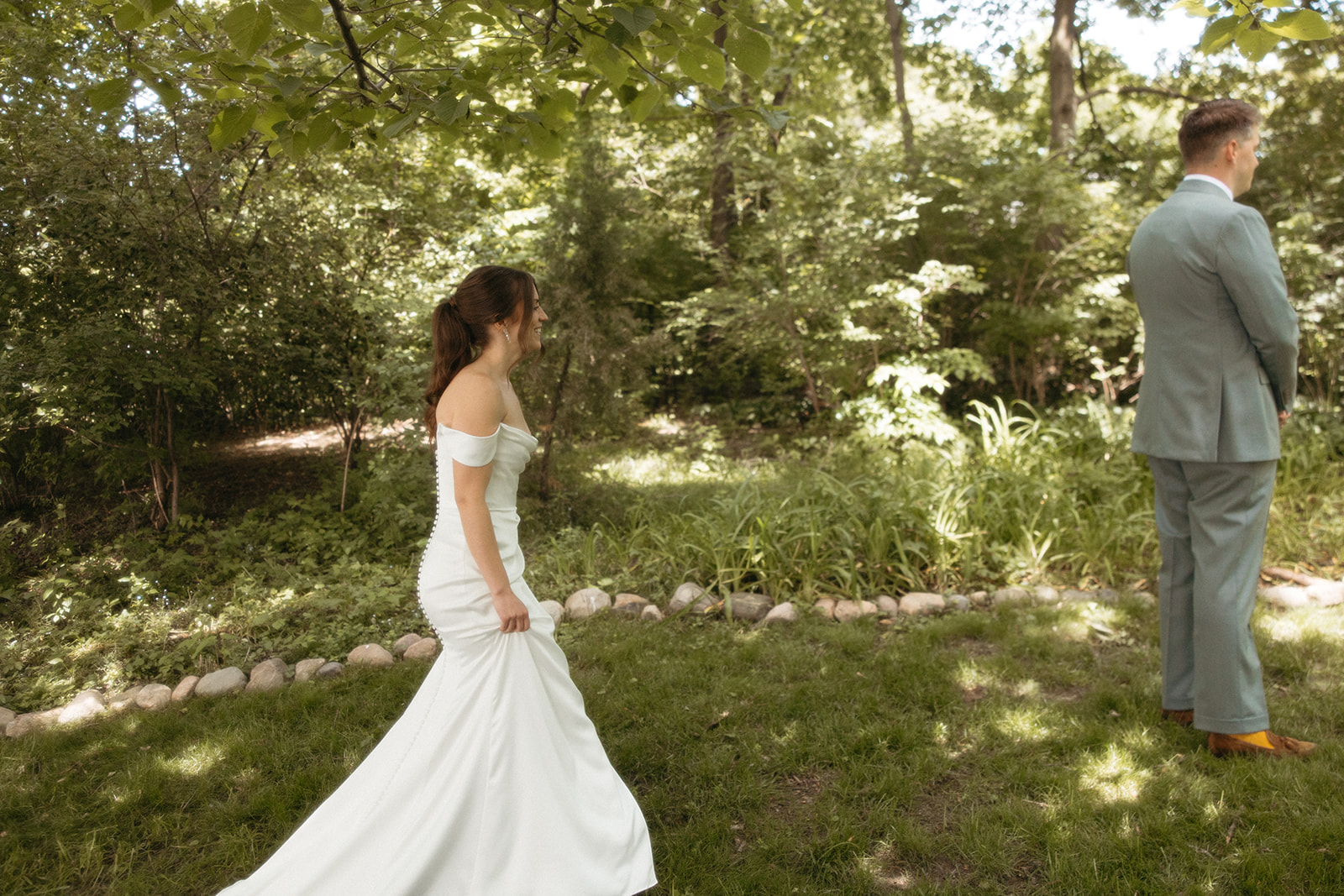 Bride walking up to share a first look with her groom