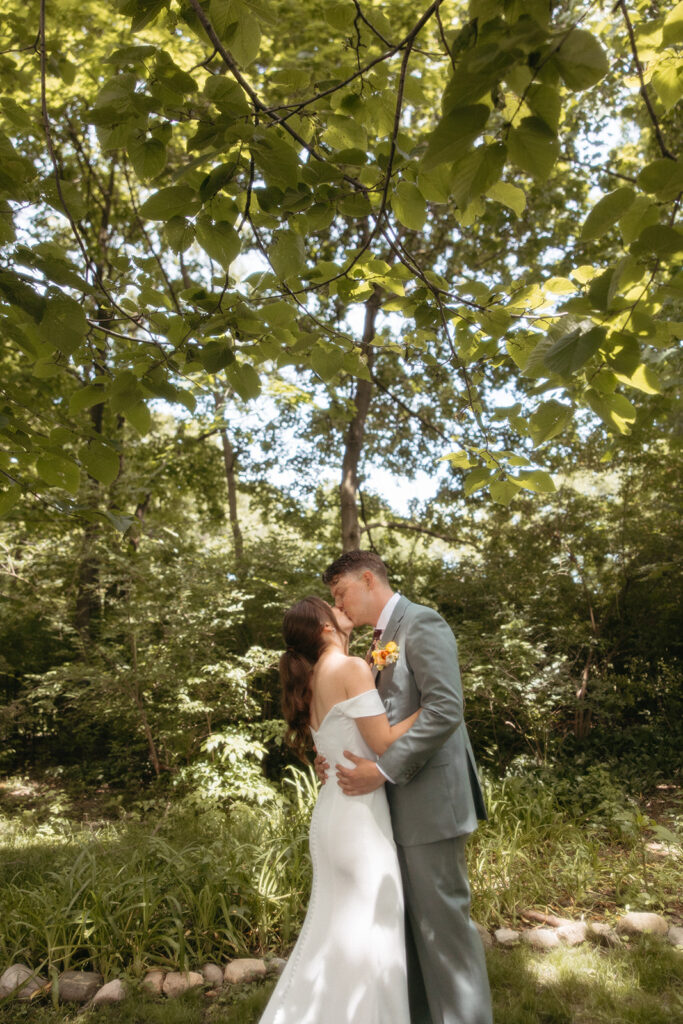 Bride and groom kissing during their first look