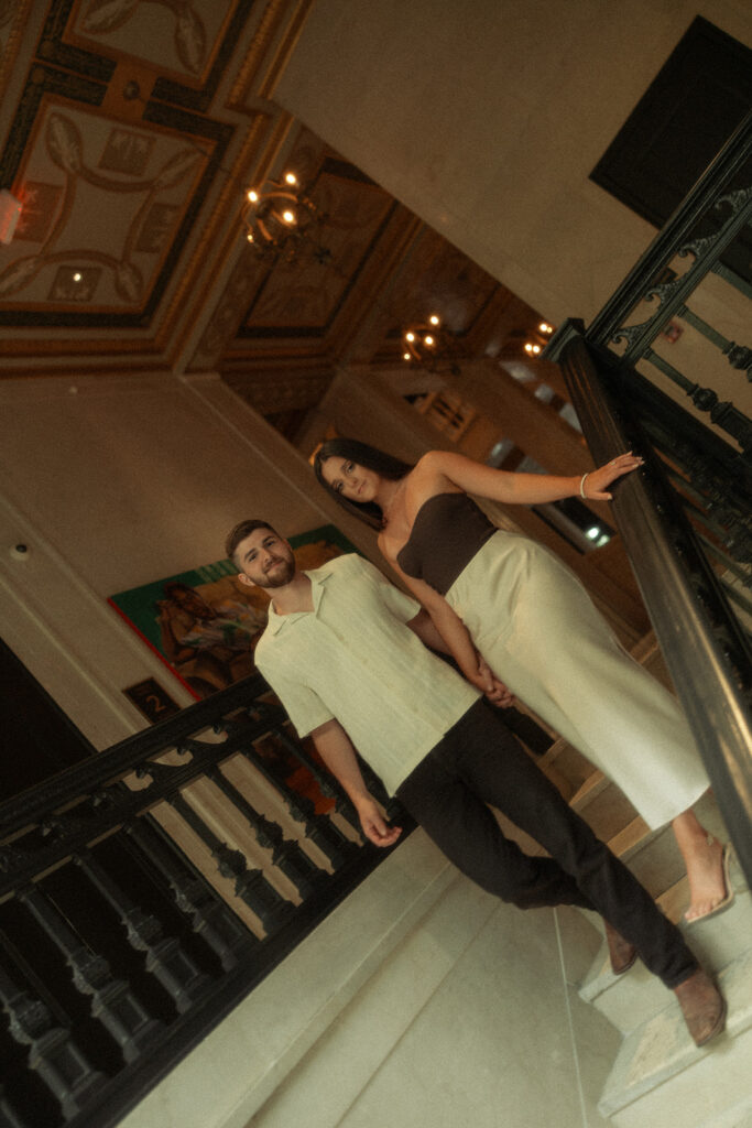 Couple walking down the stairs at Book Tower in Detroit